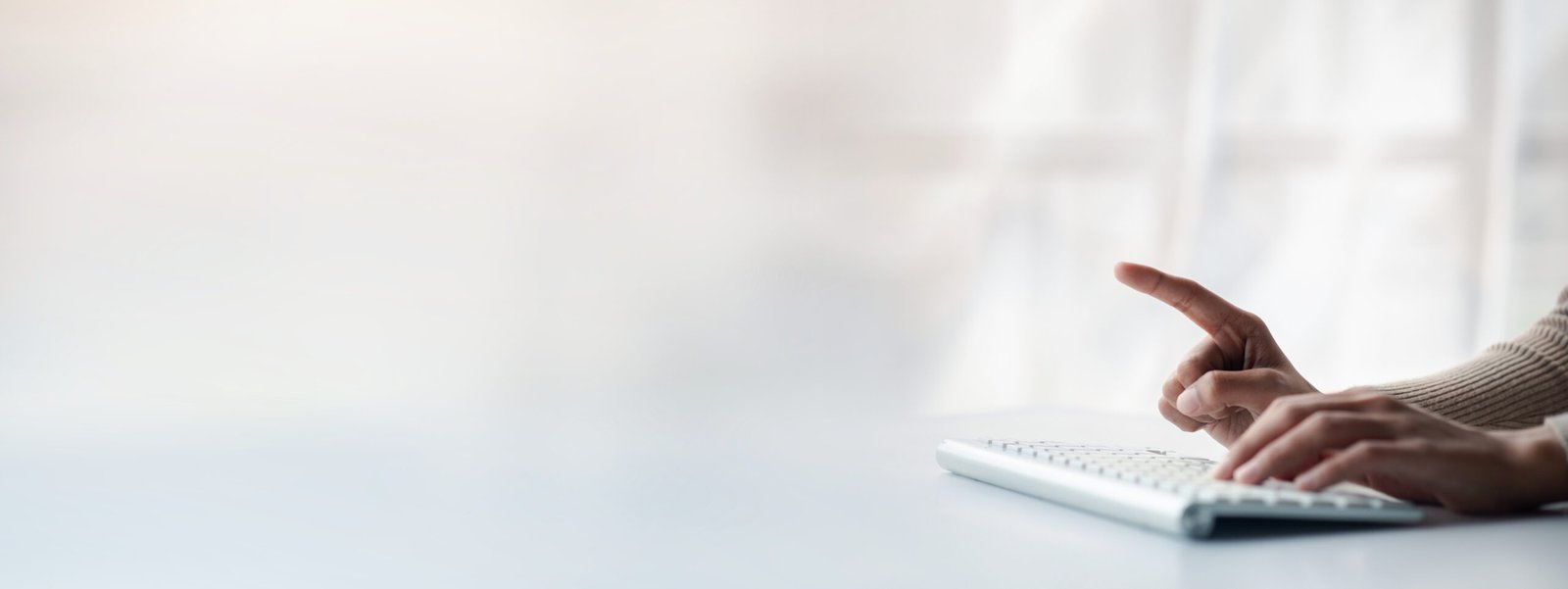 person typing on a computer keyboard, businessman is working in